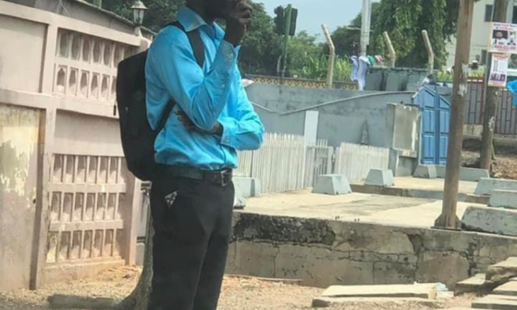 THE AGONY OF A GRADUATE: A phd holder with a placard on the street of the city of ghana lamenting over unemployment